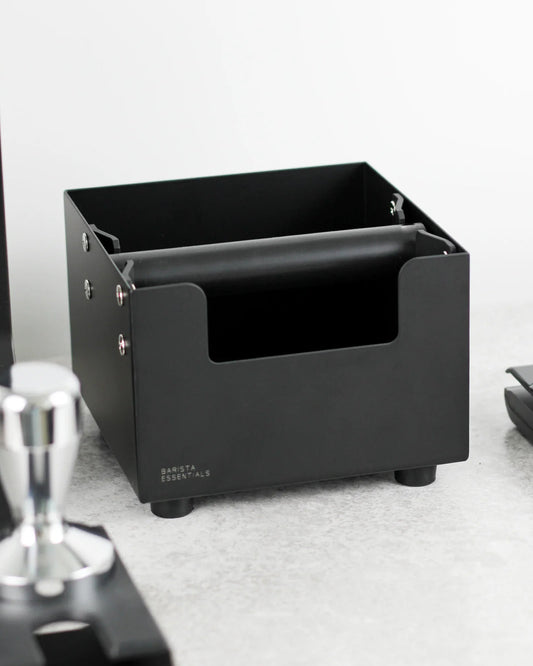 Square coffee knock box in a home barista coffee corner