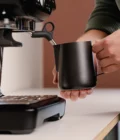 Barista using a Stainless Steel Milk pitcher latte art Essentials 600ml black