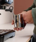 Barista using a Stainless Steel Milk pitcher latte art Essentials 350ml Italian style