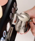 Barista creating milk foam for latte art in Stainless Steel Milk pitcher latte art Essentials 350ml Italian style
