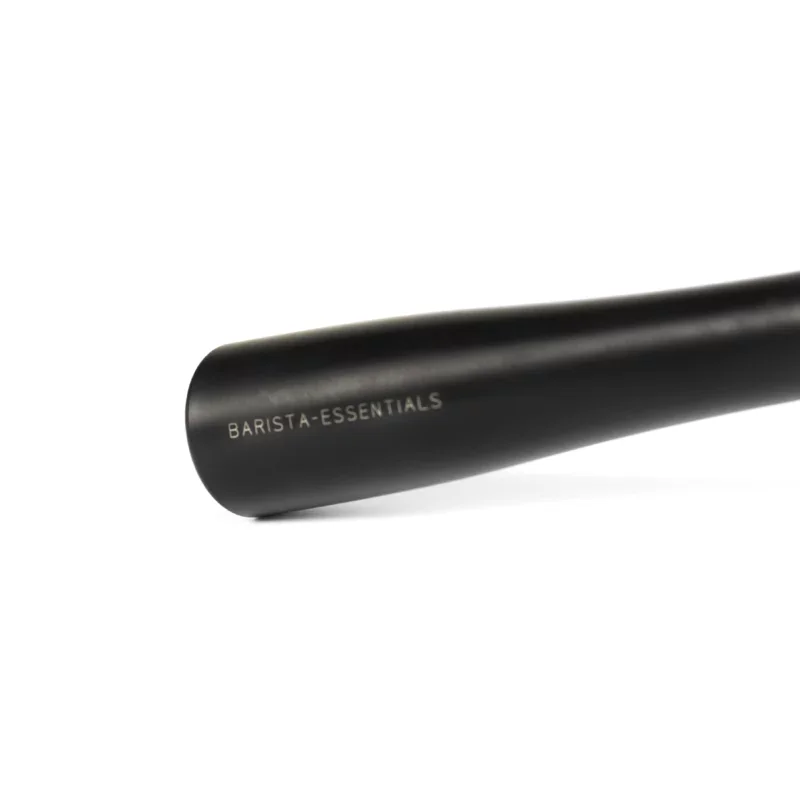 Detail of a wooden portafilter handle, with the logo 'Barista Essentials' shown