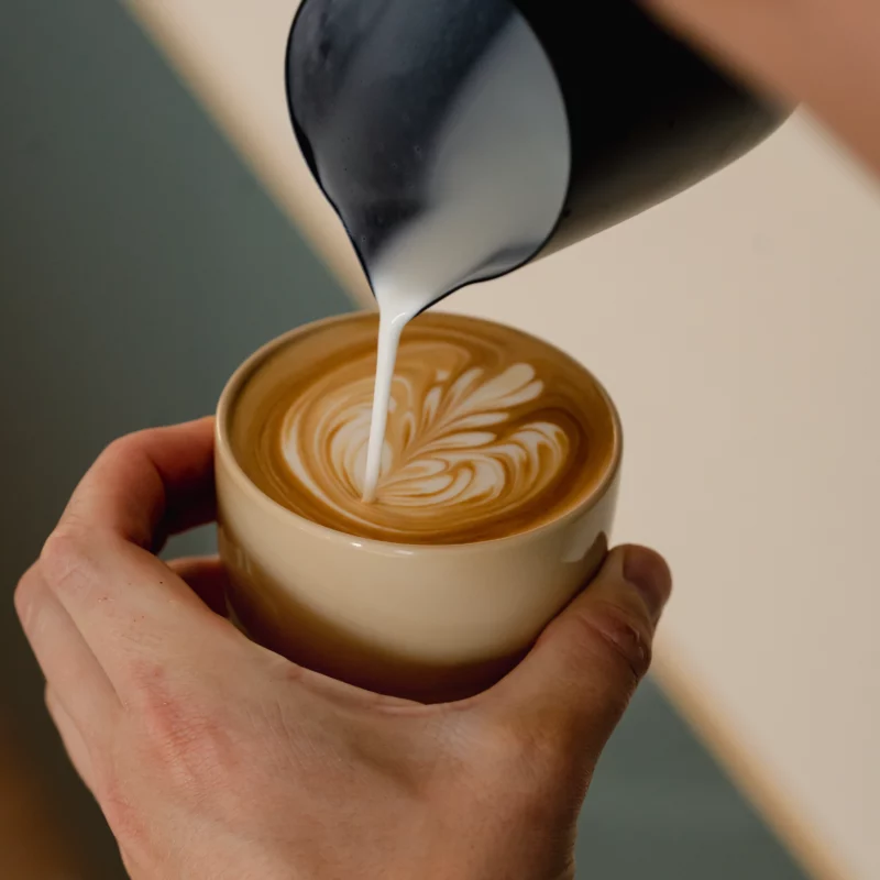 Pouring Latte art in Latte coffee cup vanilla yellow by Barista-Essentials