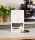 Latte art gift set for home baristas from Barista Essentials. The set contains freshly roasted coffee beans, a cappuccino cup and a milk jug